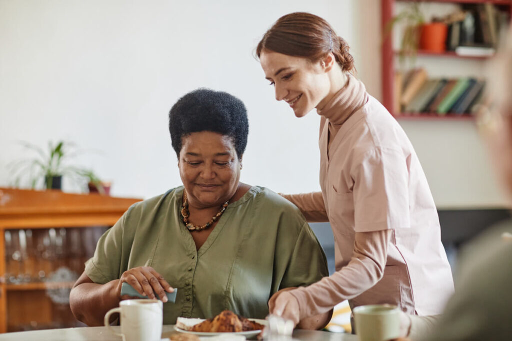 young-woman-working-in-nursing-home-SUYWRQ9